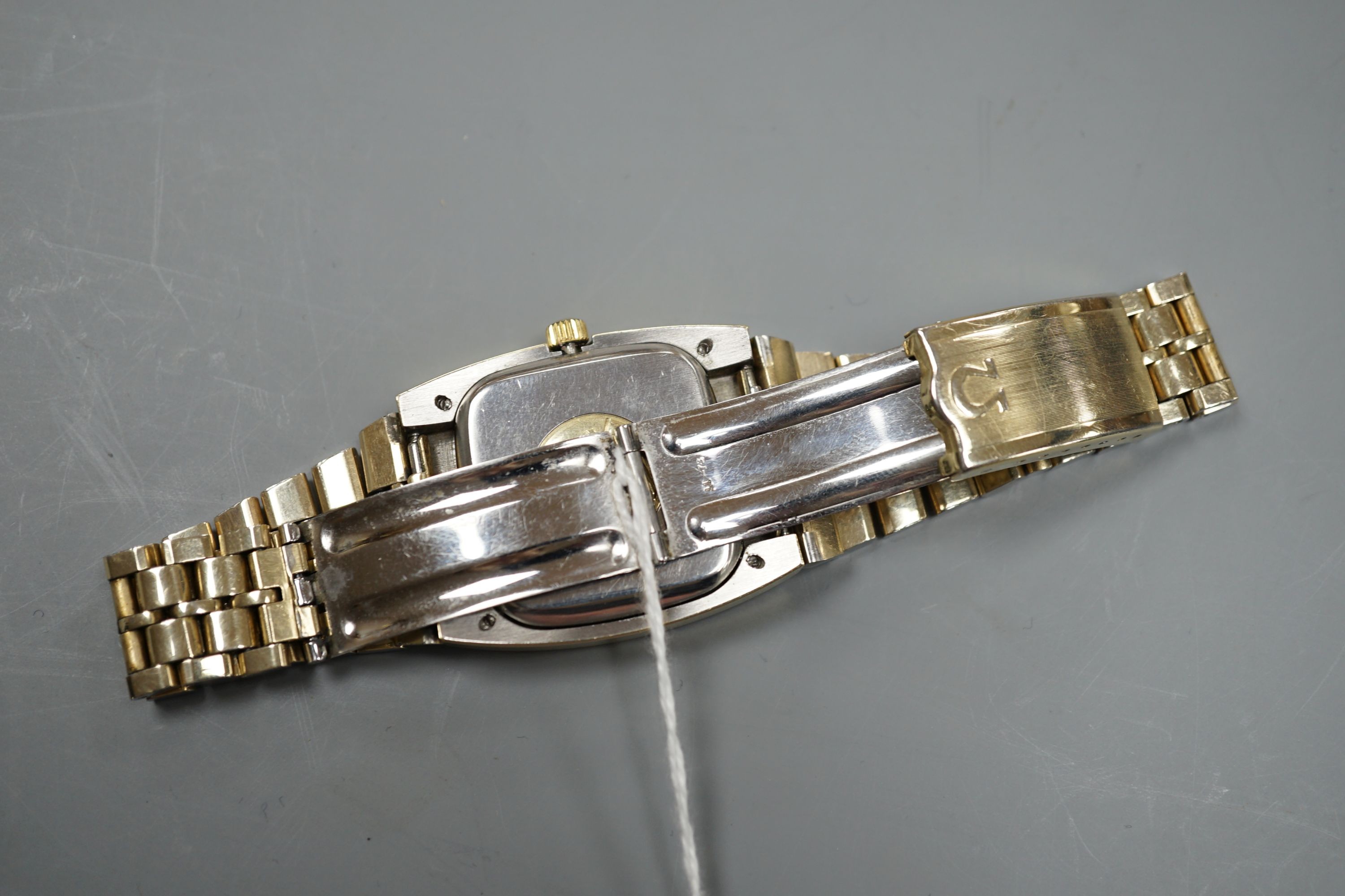 A gentleman's steel and gold plated Omega Constellation automatic wrist watch, on a steel and gold plated Omega bracelet, case diameter 34mm, no box or papers.